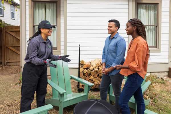 technician outside with customers