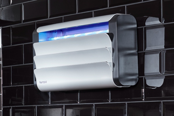 Lumnia fly control on a black wall