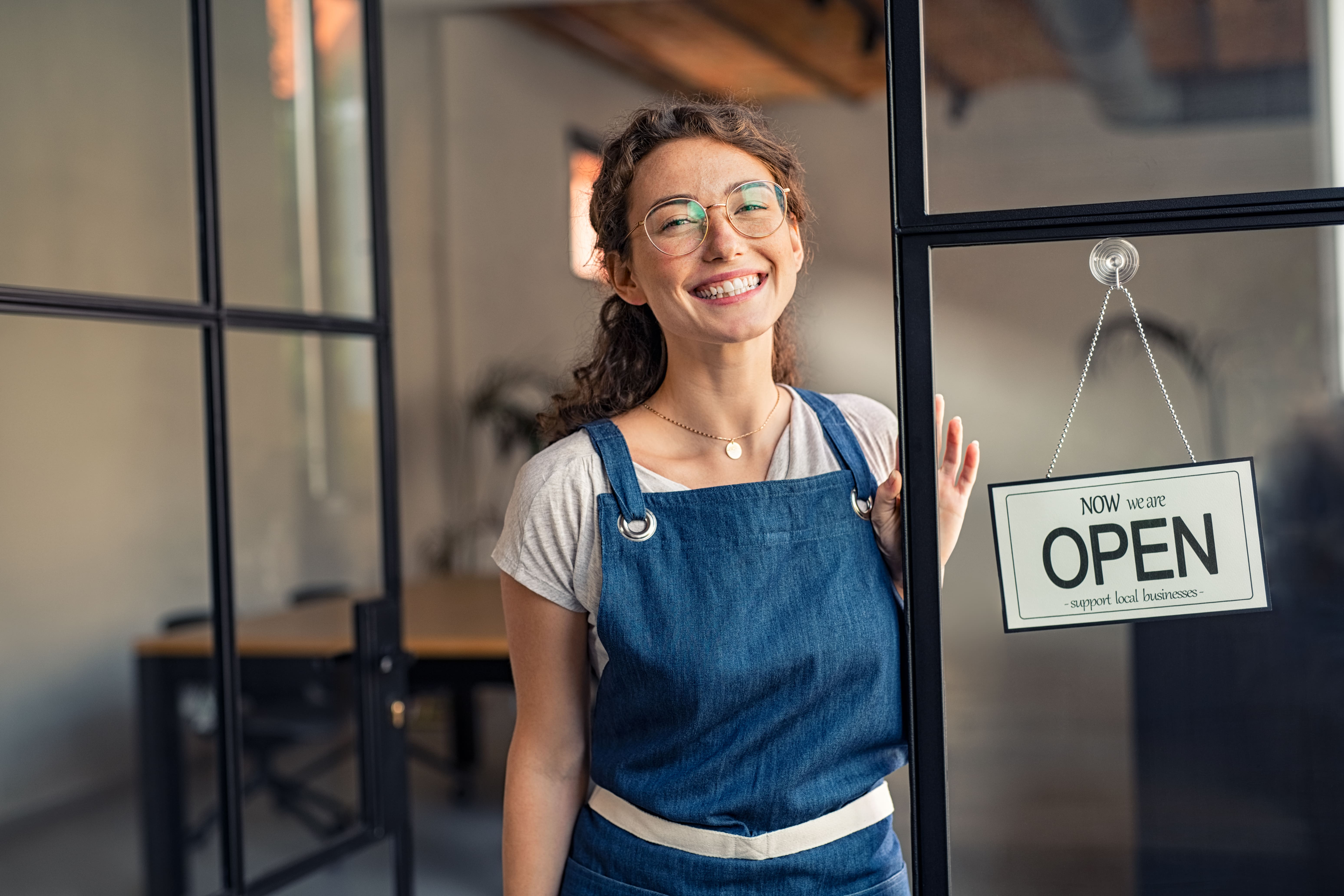 woman opening store