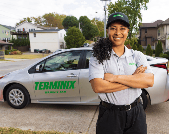 Terminix tech in from of Terminix car