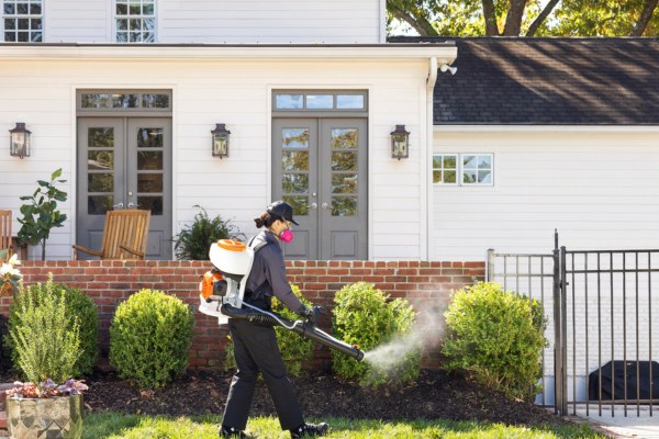 Terminix technician spraying