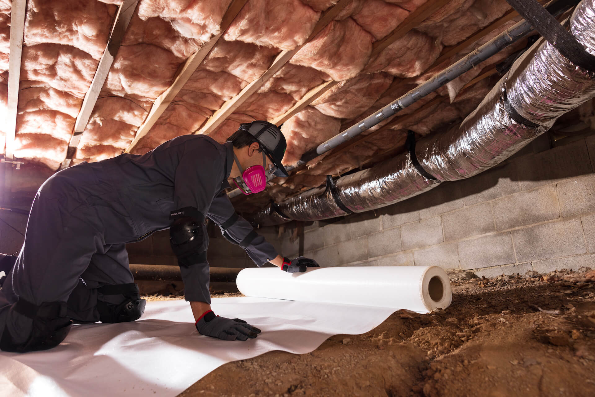 Terminix colleague installing vapor barrier