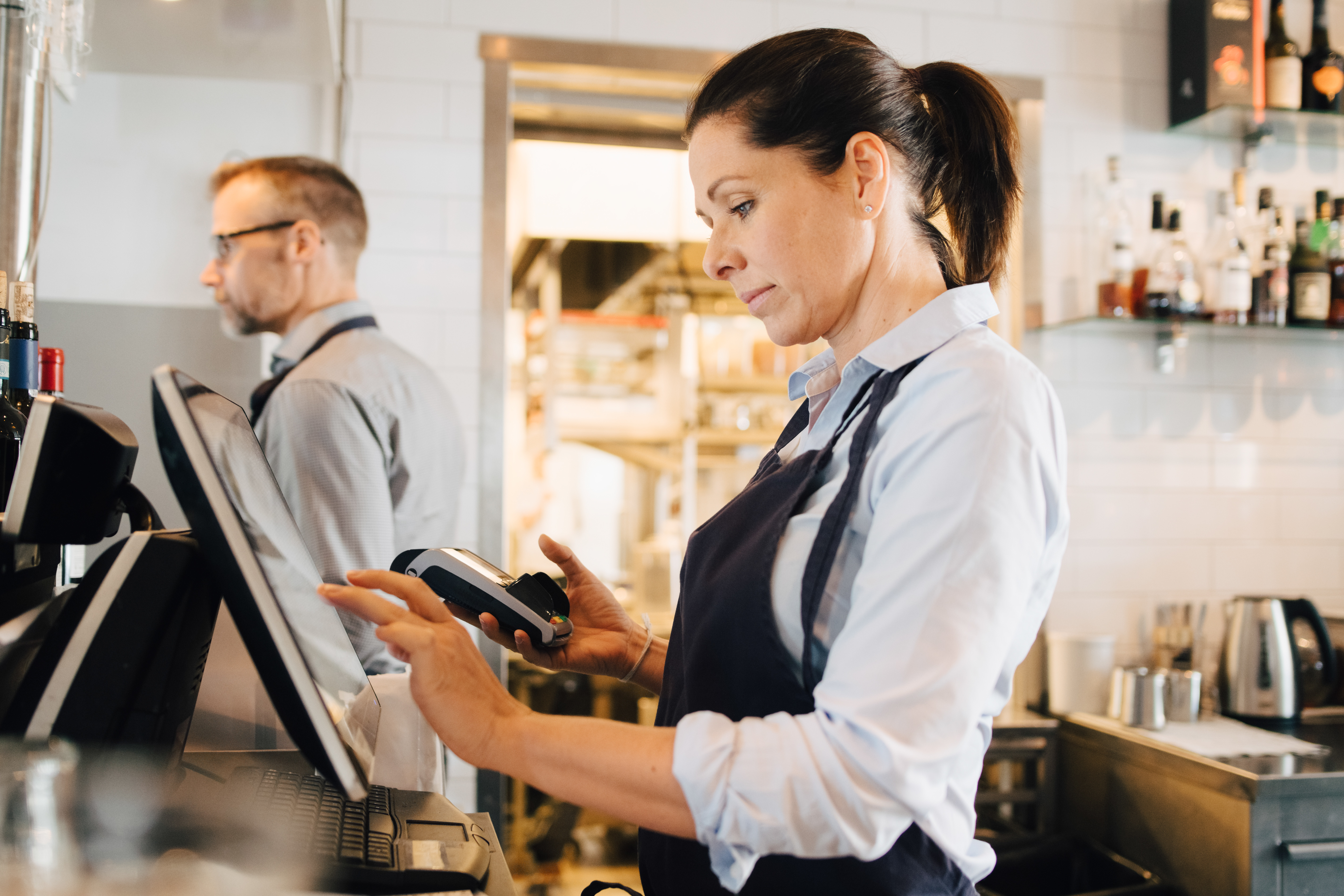 woman behind cash register