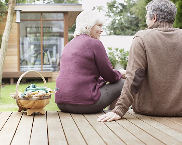 couple sitting outside on deck