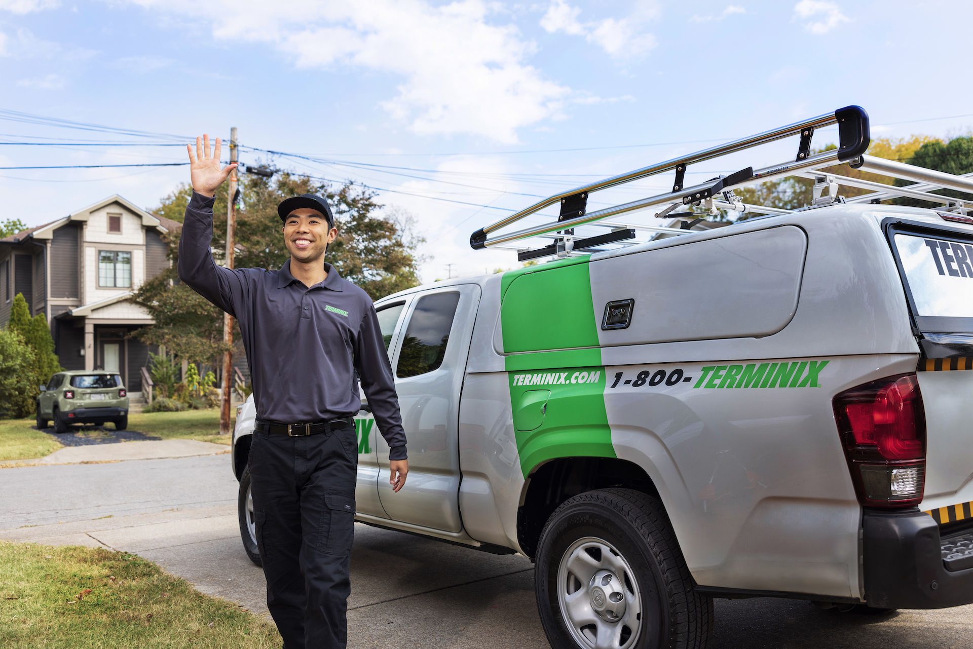 Terminix technician waving