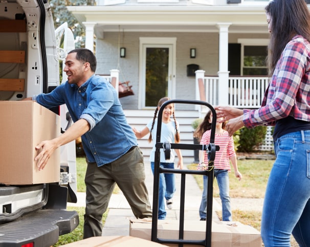 People loading boxes into moving truck