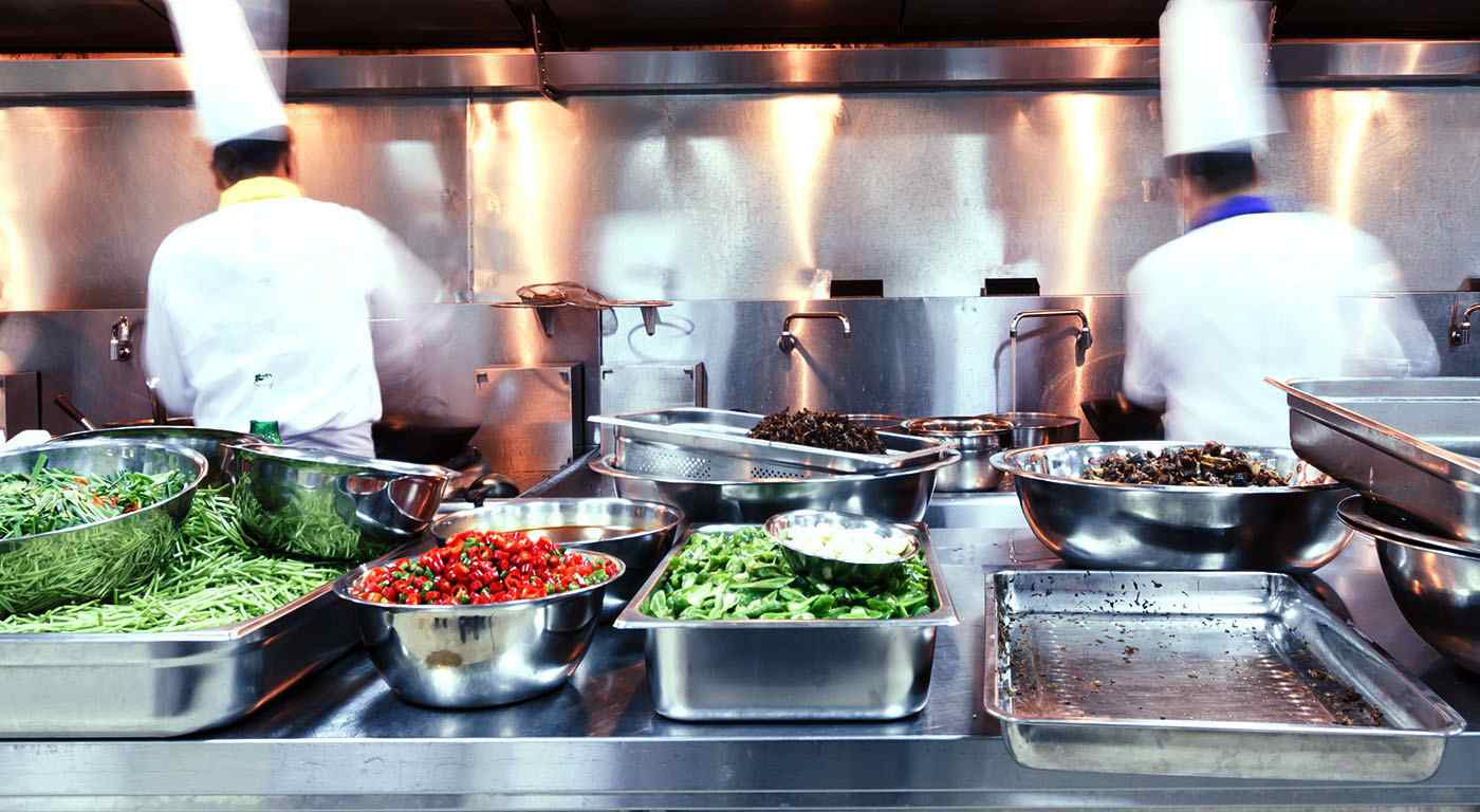 chefs in kitchen cooking