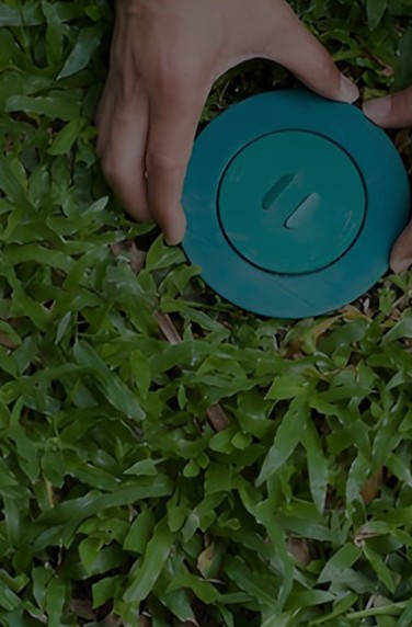 termite bait station being installed in the ground